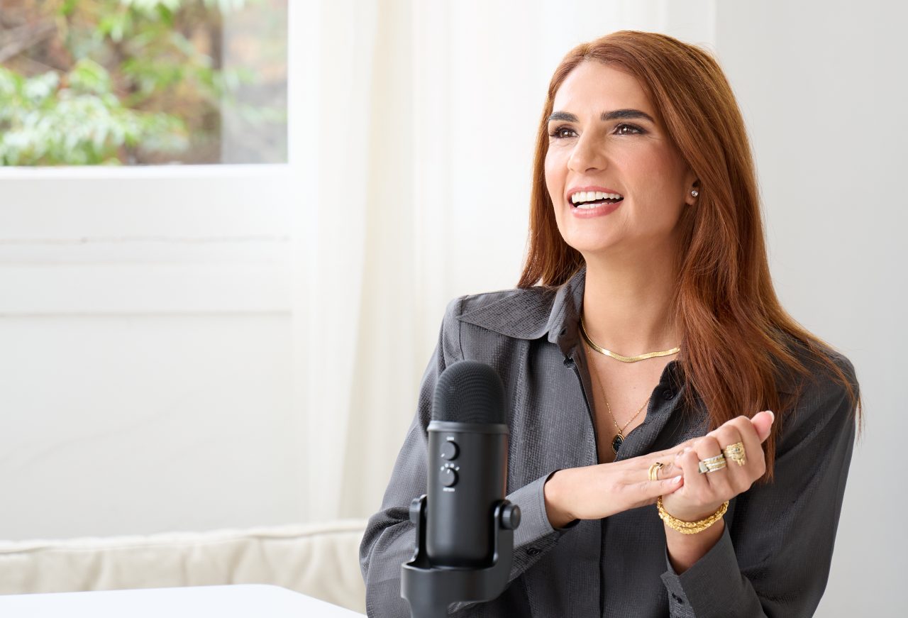 Janet McLeod talking into a microphone