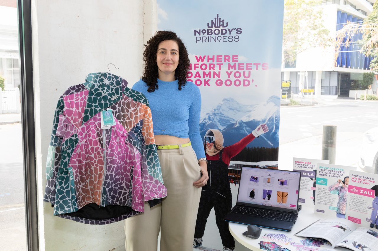 Maria Baker: Owner of Nobody's Princess standing at stall with her line of snow apparel